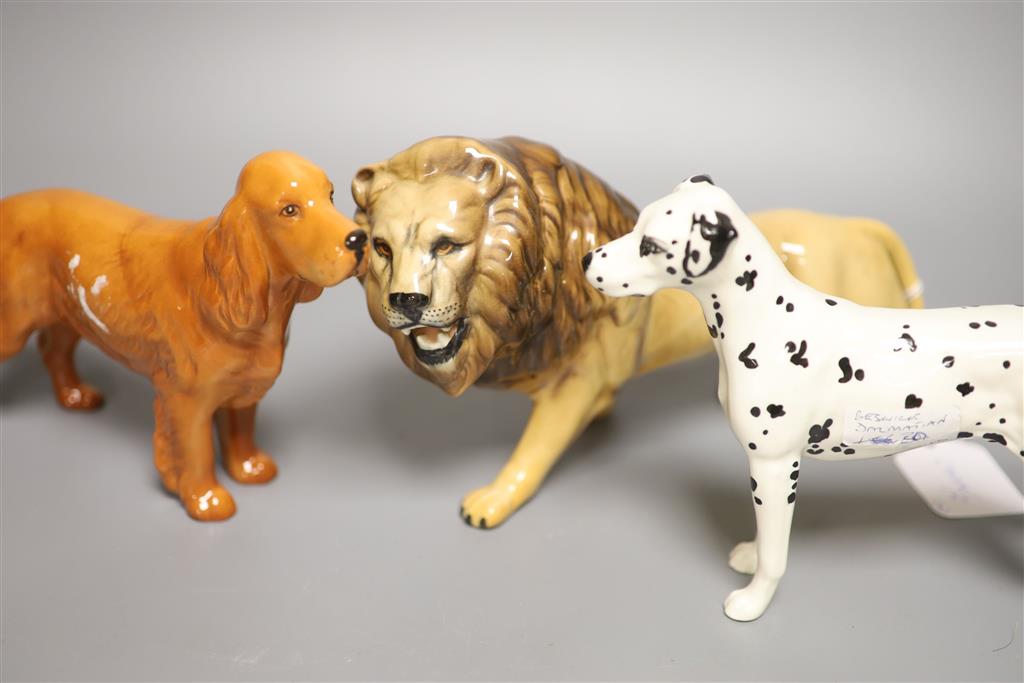 Two Beswick dogs, a lion and a lioness